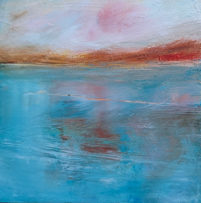 warm autumn colours over a turquoise sea